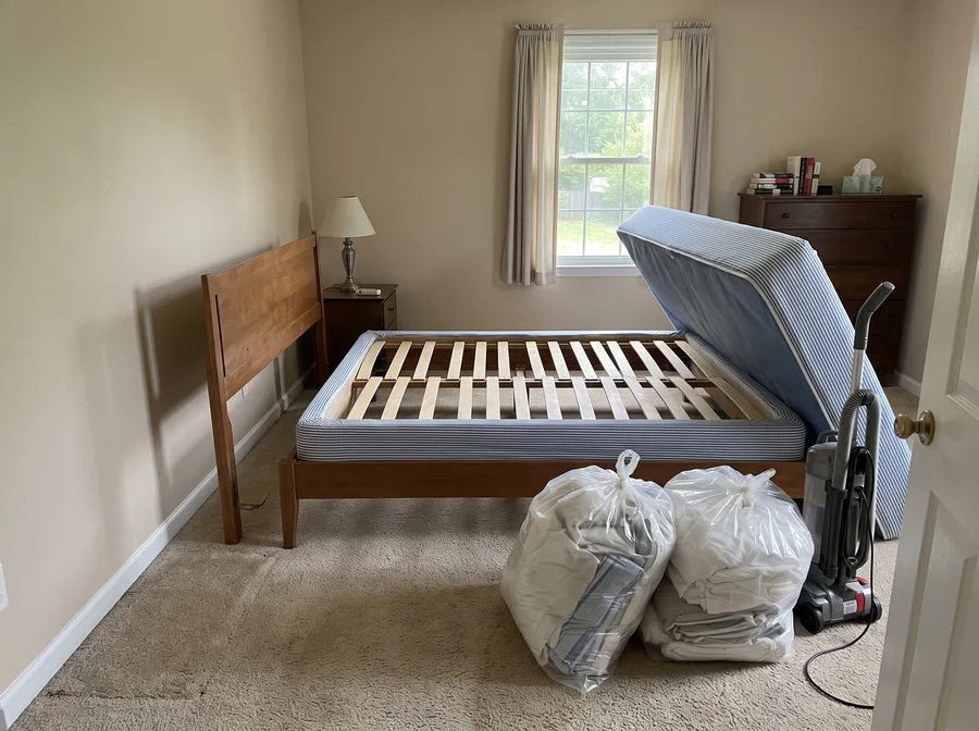 Illustration of a carpeted bedroom prepared for a carpet and upholstery treatment.